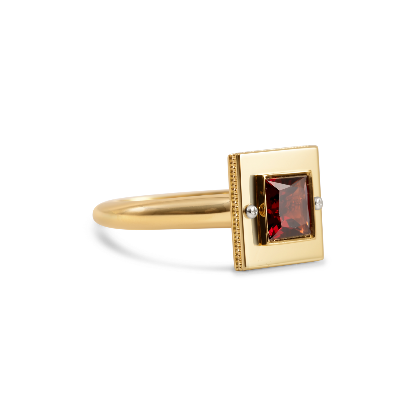 Gold ring with red garnet gemstone