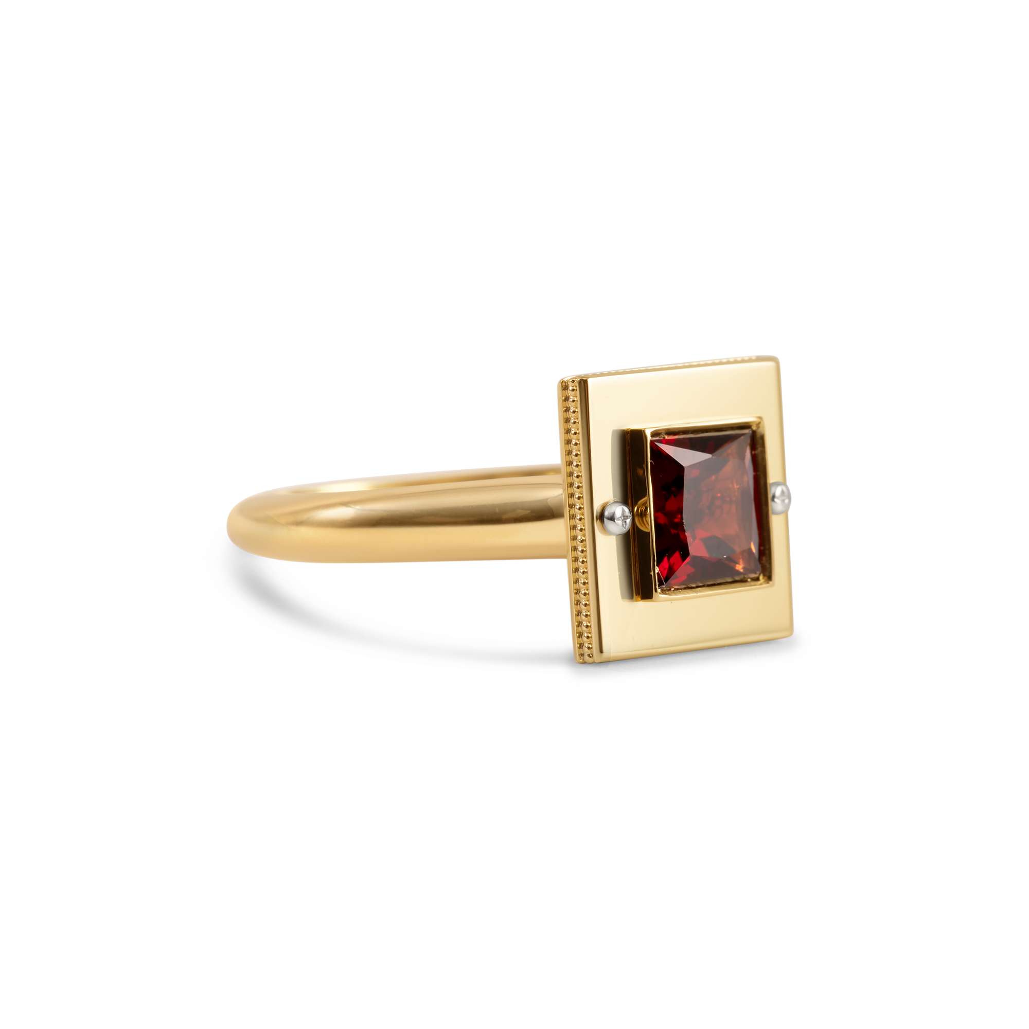 Gold ring with red garnet gemstone